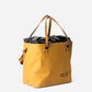 RUX 30L Waterproof Tote in bronze, rux 30l waterproof tote rux wptote 30l bronze waterproof front 34 right straps up product view on white background