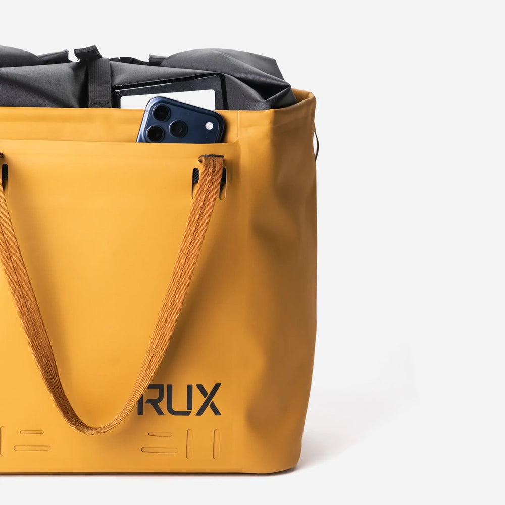 RUX 30L Waterproof Tote in bronze, rux 30l waterproof tote rux waterproof tote 30l bronze waterproof front pocket product view on white background