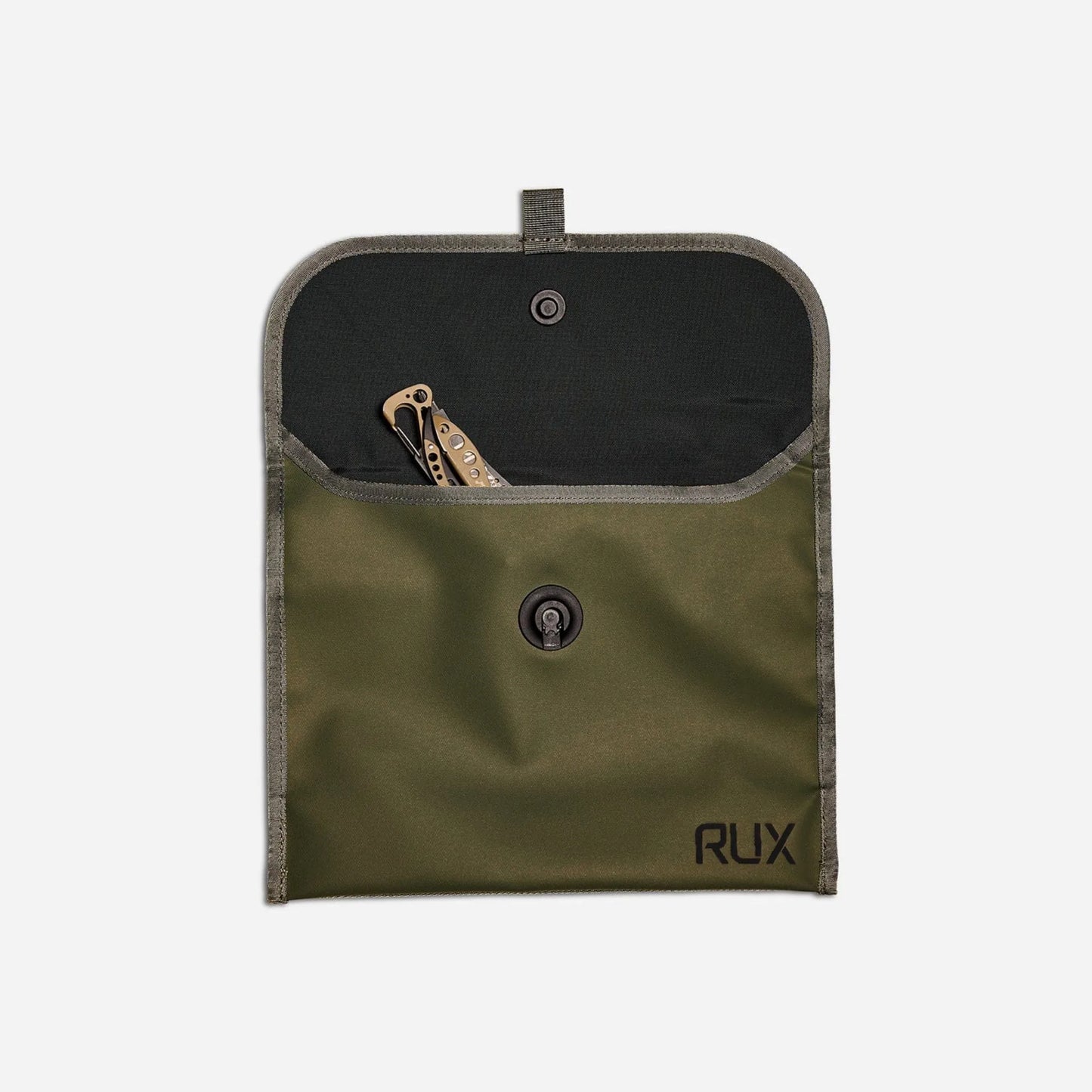 Rux 3L Pocket open with tools inside showing utility storage capability.