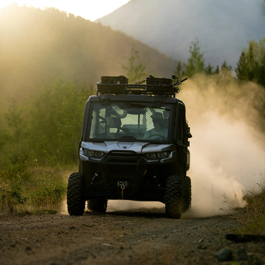 RUX 40L black overland gear storage box secured on an off-road vehicle in an outdoor adventure setting