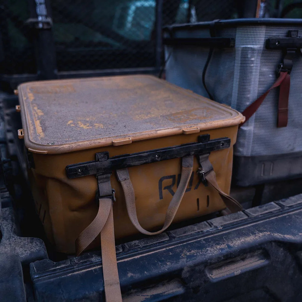 Rux 40L tote in back of ATV dirty top and side view