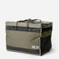 RUX 55L Duffle Box side profile showing carry straps and logo. 