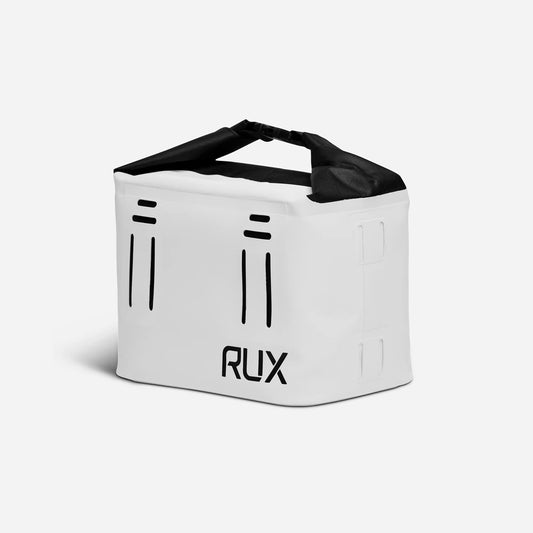 RUX 5L Cooler in white shown open with beverage cans inside.