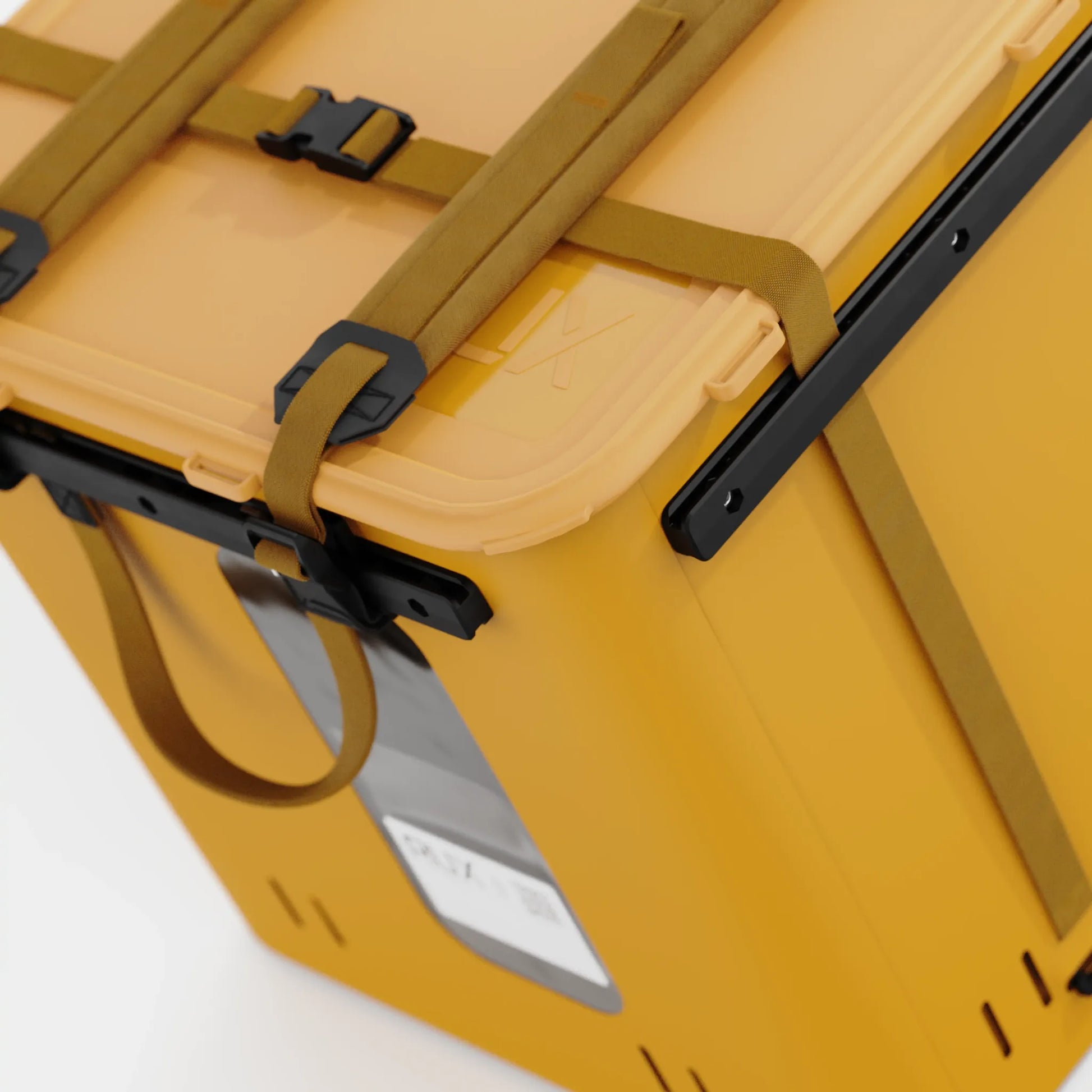 Rux 70L Press-Seal bronze container overhead lid detail showing press-seal top, compression straps, and buckle system.