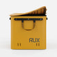 Rux 70L Press-Seal bronze container partially open with flexible press-seal lid, carry handle, and hard-sided storage body.