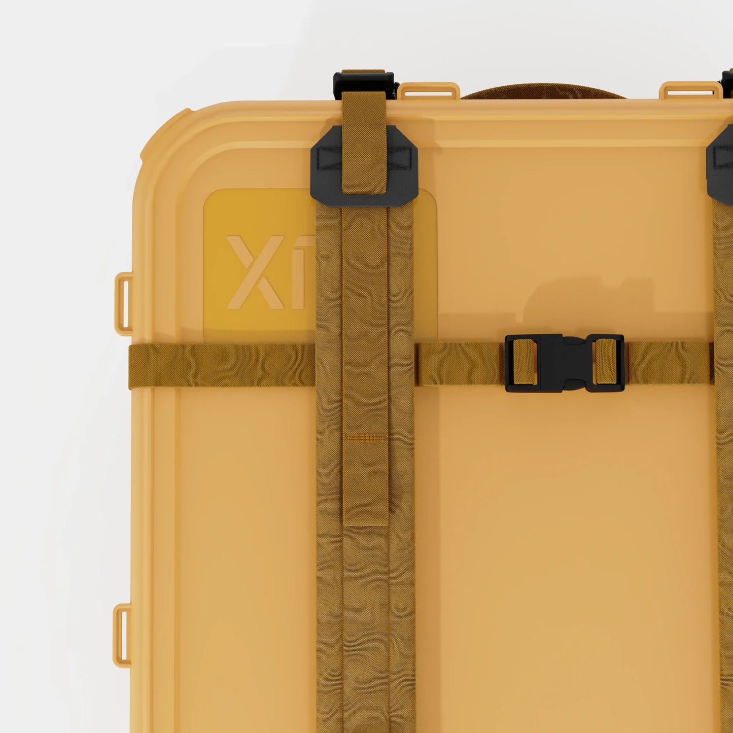 Rux 70L Press-Seal bronze container top detail showing lid strap, buckle, reinforced rail, and compression closure system.