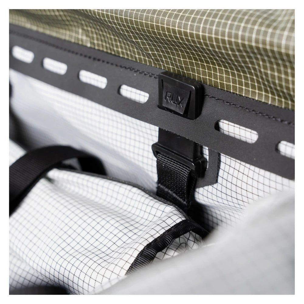 Rux DuffleBox 75L buckle closure detail with modular attachment system