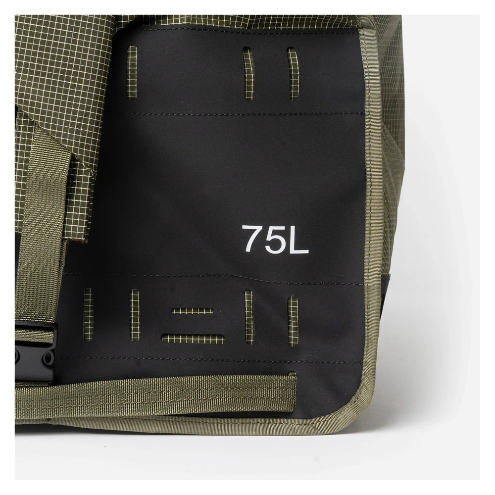 Rux DuffleBox 75L capacity detail showing rugged outdoor materials and branding
