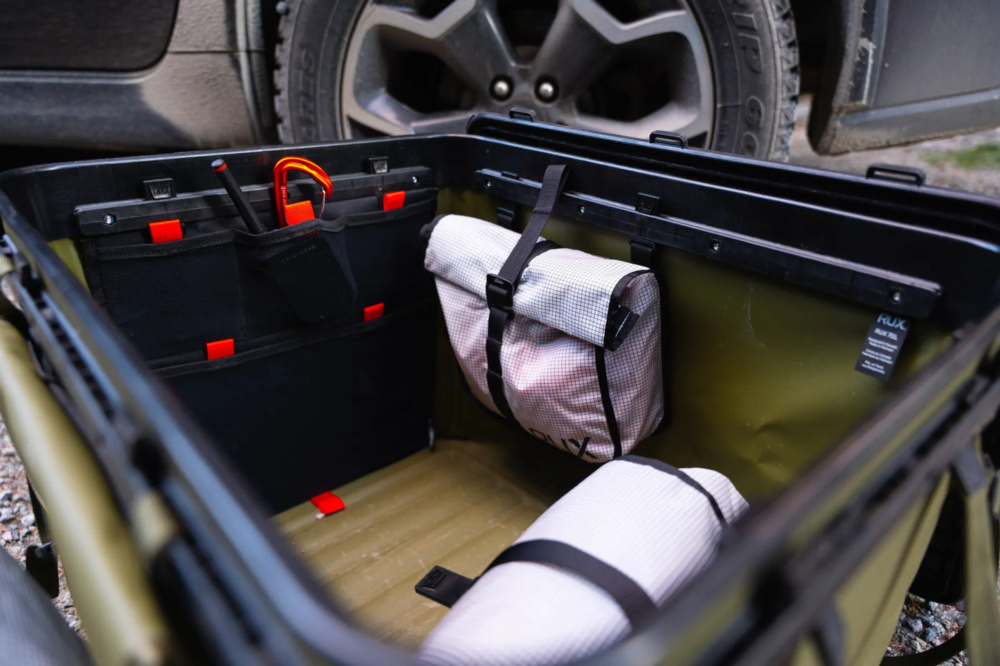Rux Packing Pocket 2L in use inside storage bin for gear organization
