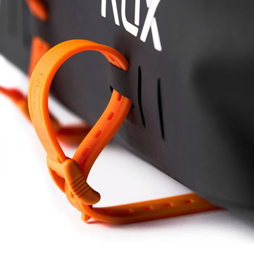 Close-up of RUX waterproof tote bag lash point attachment system with orange strap