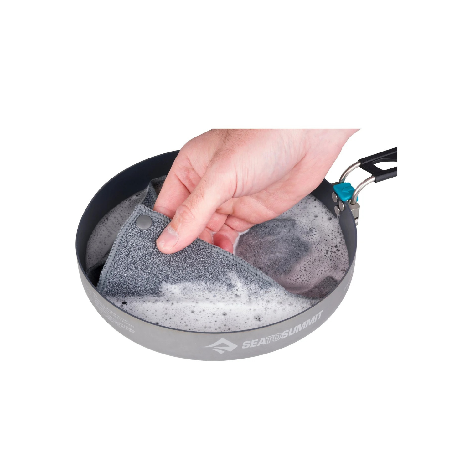 Sea to Summit camp kitchen washcloth being used to clean cookware in outdoor camping setup