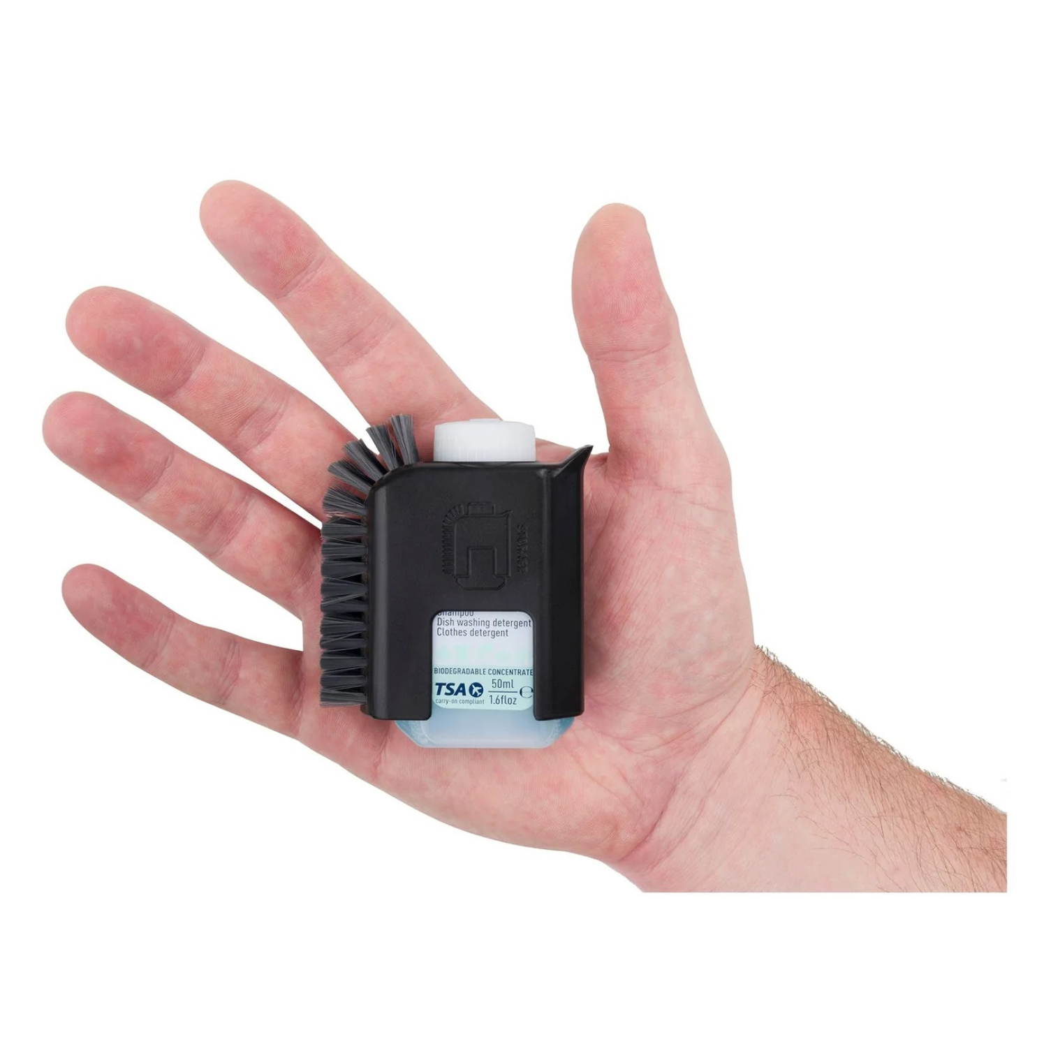 Sea to Summit Camp Pot Scrubber with integrated soap bottle held in hand showing compact size