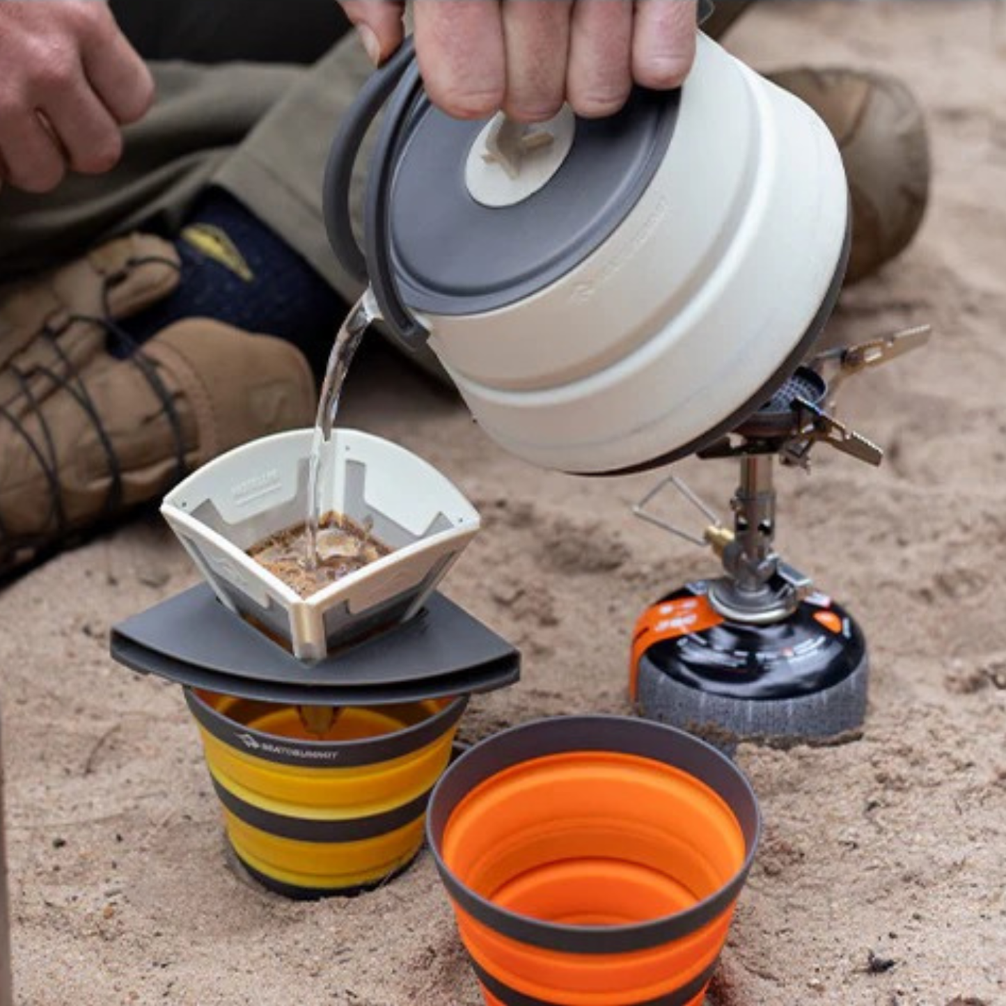 Sea to Summit Frontier collapsible pour over brewing coffee outdoors with camping kettle and cup