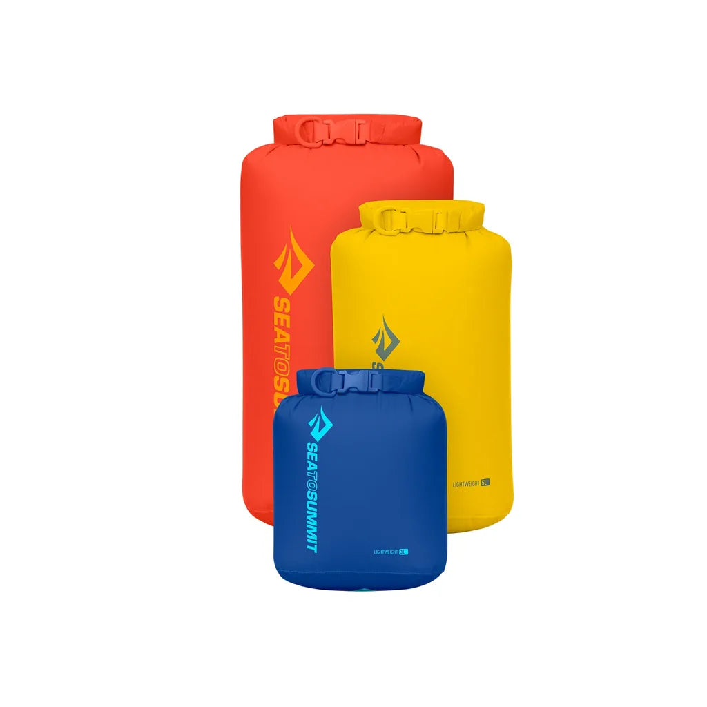 Sea to Summit Lightweight Dry Bag set in three sizes and colors: large orange, medium yellow and small blue 3L roll-top dry bags