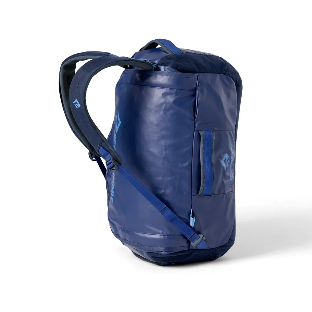 Rear view of the navy Sea to Summit Meridian Duffle Bag with padded backpack shoulder straps and buckled side straps