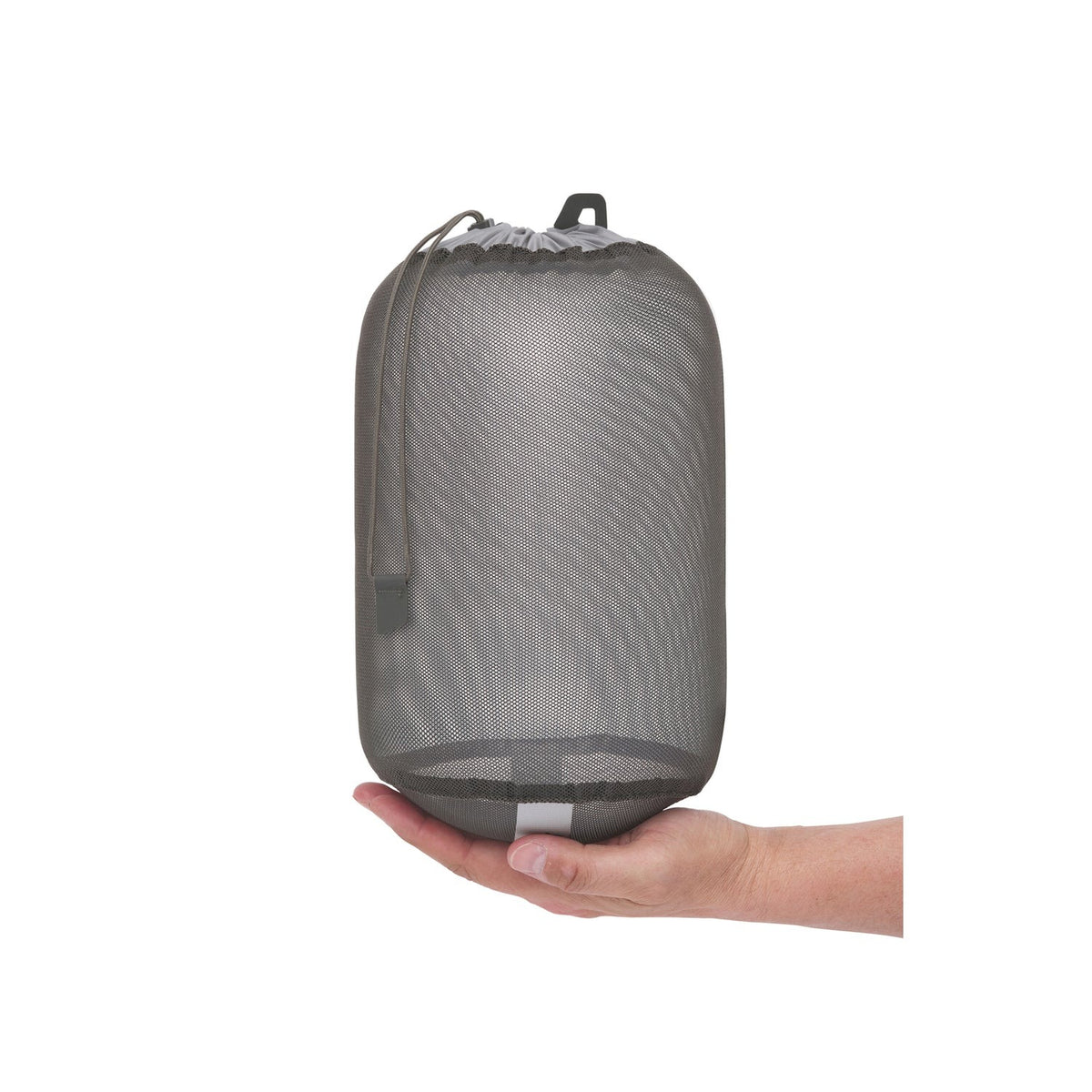 Sea to Summit mesh stuff sack held in one hand to show its compact packed size