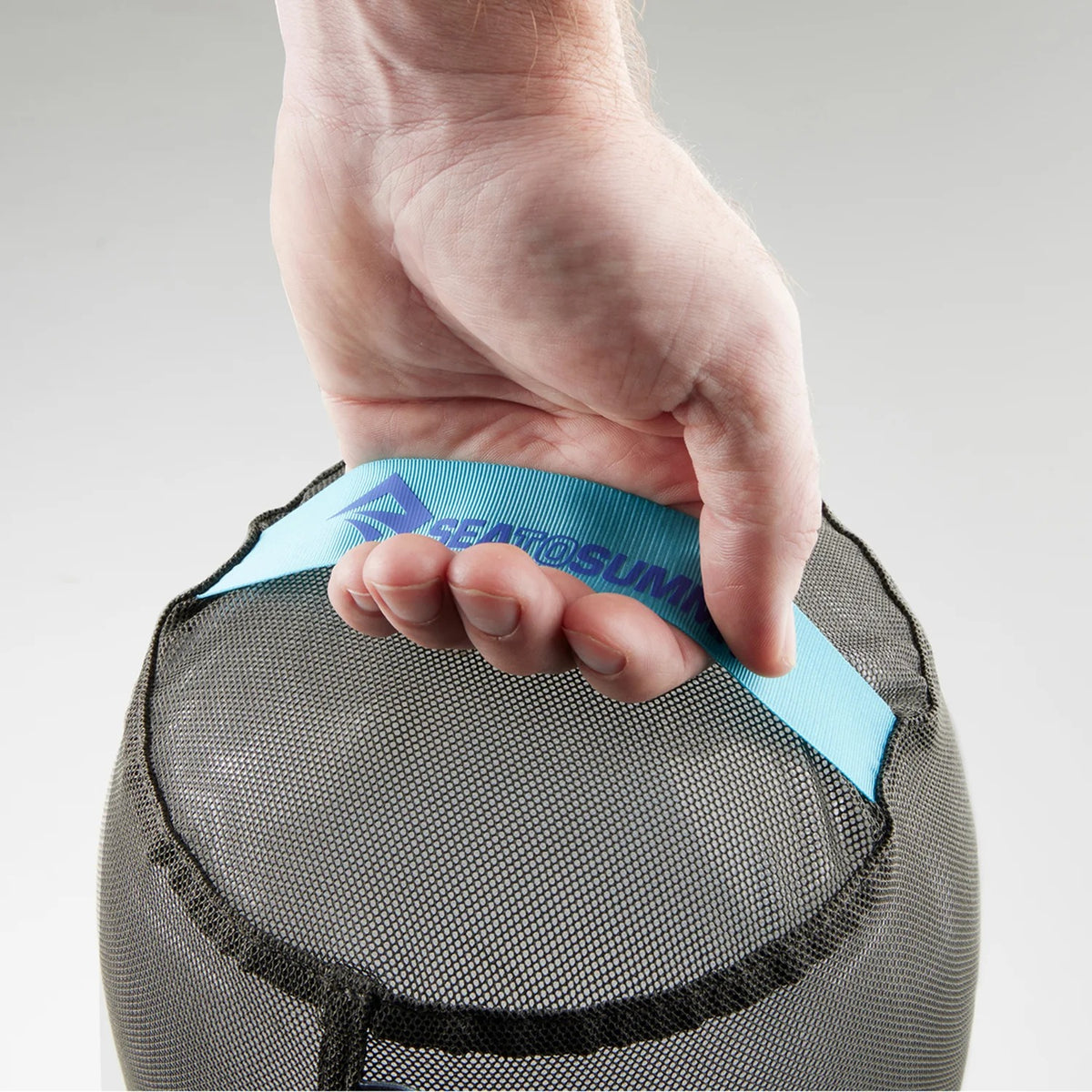 Close-up of the Sea to Summit mesh stuff sack’s nylon webbing carry handle