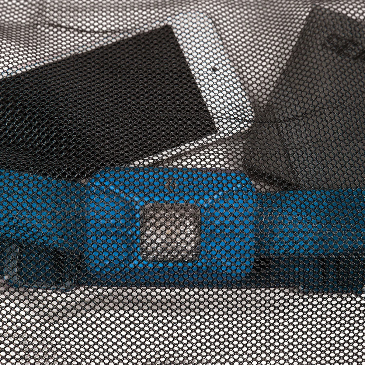 Close-up of the Sea to Summit mesh stuff sack’s mesh panels in black, gray, and blue