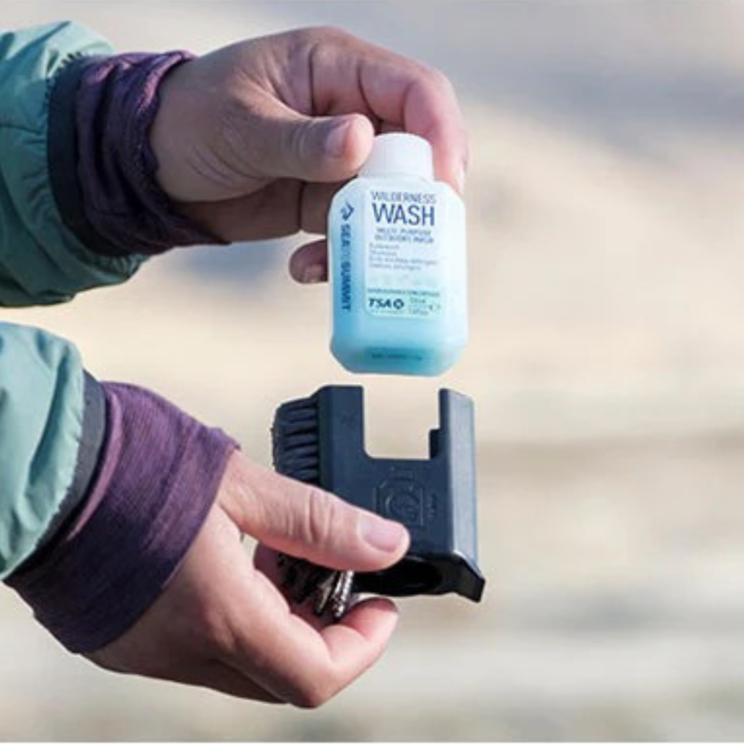 Sea to Summit pot scrubber with removable Wilderness Wash bottle for compact camping cleaning system
