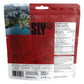 Sly Foods General Tao freeze-dried meal package back showing nutrition facts panel with 410 calories per serving, 12g protein, ingredients list in English and French, step-by-step preparation instructions with icons, SLY logo, barcode, and scenic mountain lake landscape photo on the left side.