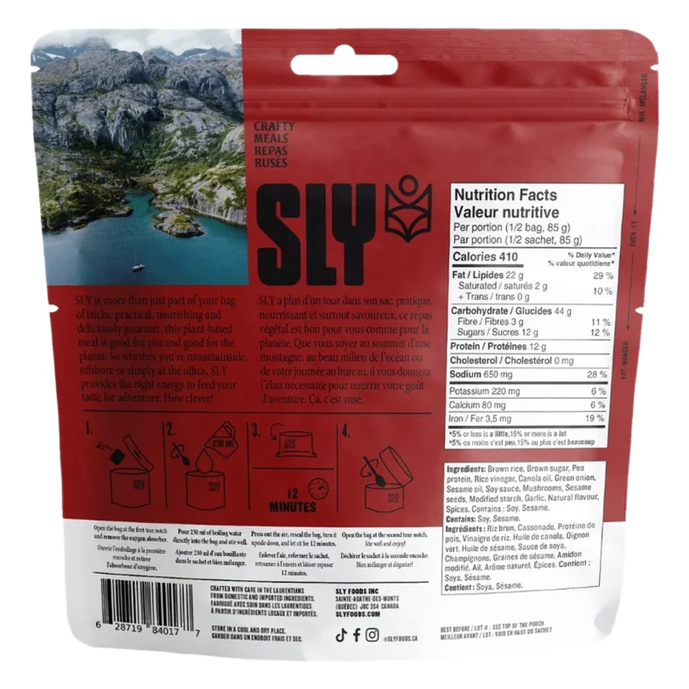 Sly Foods General Tao freeze-dried meal package back showing nutrition facts panel with 410 calories per serving, 12g protein, ingredients list in English and French, step-by-step preparation instructions with icons, SLY logo, barcode, and scenic mountain lake landscape photo on the left side.