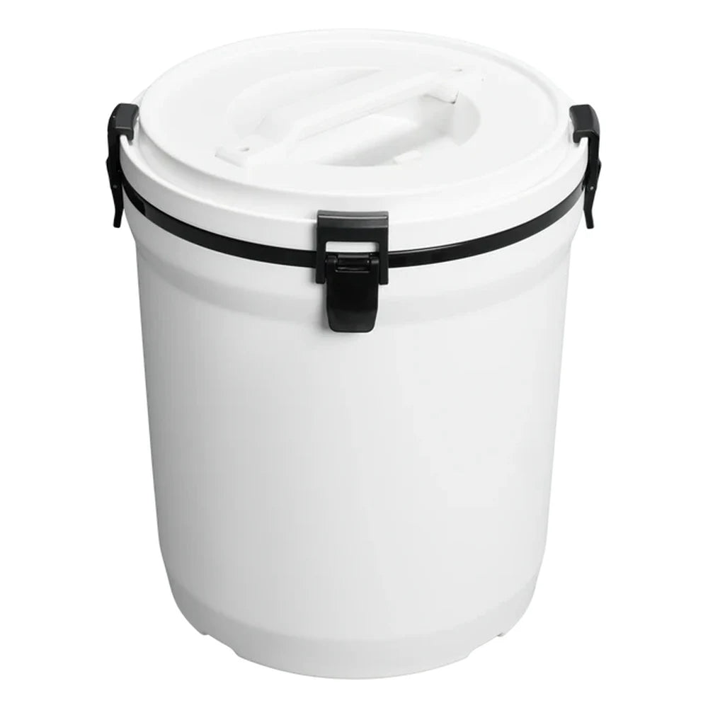 Stanley Adventure Fast Flow Water Jug 2 Gallon in Chalk front hero on white background showing white cylindrical body with Stanley winged bear embossed logo, dark charcoal gray fast-flow spigot with lever handle at the front base, and dark gray latch hardware securing the lid