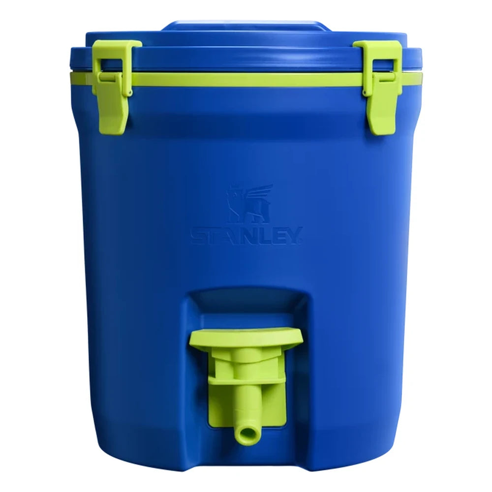 Stanley Adventure Fast Flow Water Jug 2 Gallon in Cobalt Chartreuse front hero on white background showing cobalt blue cylindrical body with Stanley winged bear embossed logo, neon chartreuse lime green fast-flow spigot with lever handle at the front base, and chartreuse green latch hardware securing the lid