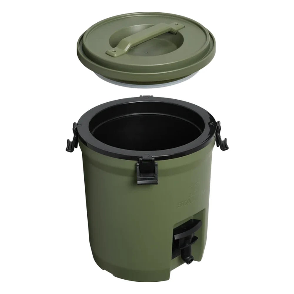 Stanley Adventure Fast Flow Water Jug 2 Gallon in Dried Pine exploded view on white background showing the olive green circular lid lifted off revealing the black rubber sealing gasket rim and olive green interior, with black spigot and black latch hardware on the body below
