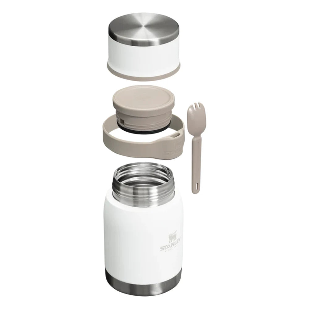 Stanley Adventure To-Go Food Jar and Spork 24oz in Frost White exploded view on white background showing all components separated: outer stainless steel lid, inner tan seal lid with strap, main white jar body with Stanley logo, and tan folding spork