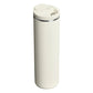 Stanley AeroLight Transit Bottle 20oz in Cream Gloss back view on white background showing smooth cream matte cylindrical body, stainless steel trim ring at the neck, and cream flip-top lid with the latch tab visible from behind