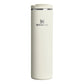 Stanley AeroLight Transit Bottle 20oz in Cream Gloss front hero on white background showing slim cream matte cylindrical bottle with Stanley winged bear logo, stainless steel trim ring at the neck, and cream flip-top lid with press-button latch