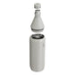 Stanley All Day Slim Bottle 34oz in Ash Gloss exploded view on white background showing all components separated: flat cap with Stanley bear icon floating above, the cone-shaped upper neck section with black sealing gasket and stainless steel threaded opening, and the cylindrical lower body with open stainless steel interior and Stanley logo