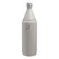 Stanley All Day Slim Bottle 34oz in Ash Gloss front hero on white background showing warm gray gloss tapered slim bottle with cone-shaped neck, flat screw cap with Stanley winged bear icon, engraved Stanley winged bear logo on body, and stainless steel trim ring at the neck