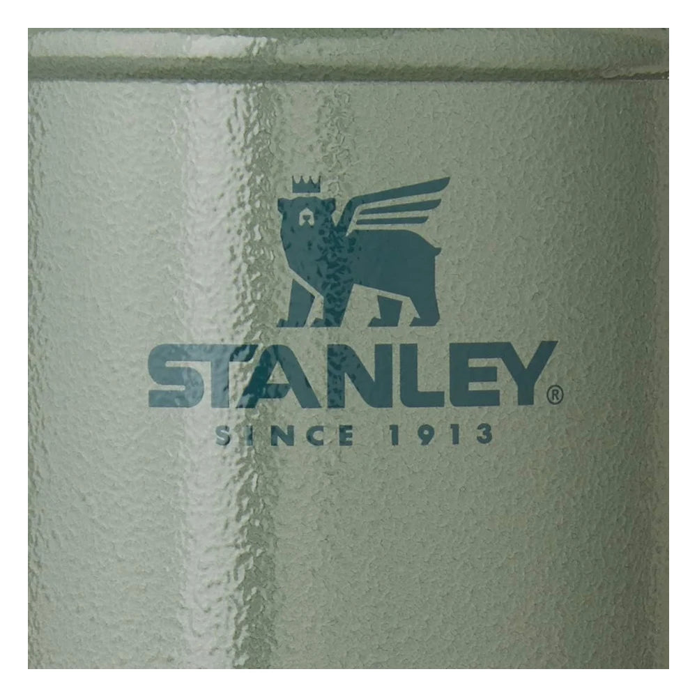Stanley Classic Legendary Food Jar 24oz in Hammertone Green close-up macro detail shot showing the hammertone pebble-textured green surface with the Stanley Since 1913 winged bear logo embossed on the body