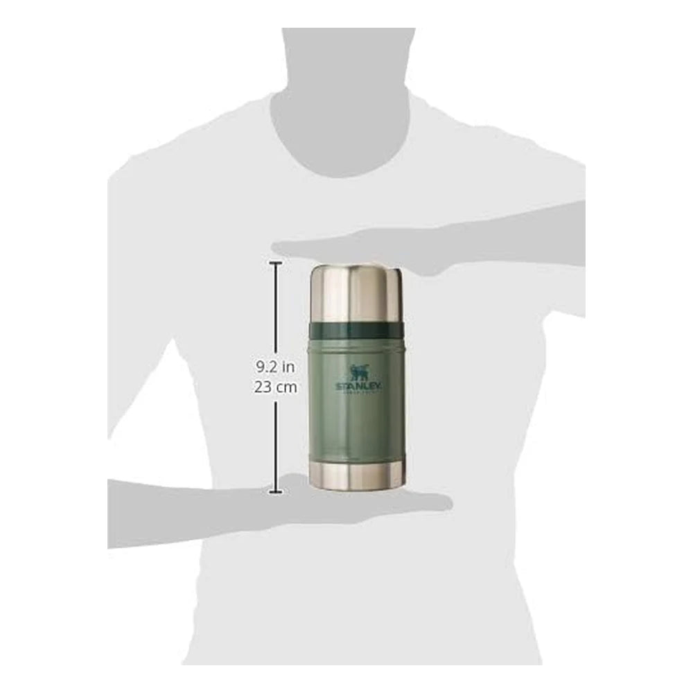 Stanley Classic Legendary Food Jar 24oz in Hammertone Green size reference callout on white background showing jar held between two silhouetted hands with dimension annotation reading 9.2 in / 23 cm height