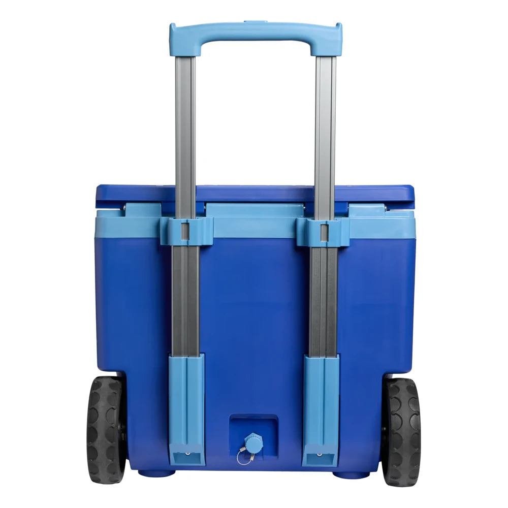 Stanley The Cold For Days Wheeled Outdoor Cooler 50QT in Azure Blue back view on white background showing the fully extended two-stage aluminum telescoping handle with sky blue grip, cobalt blue body, two large black all-terrain wheels, and drain plug with tethered sky blue cap at the bottom center