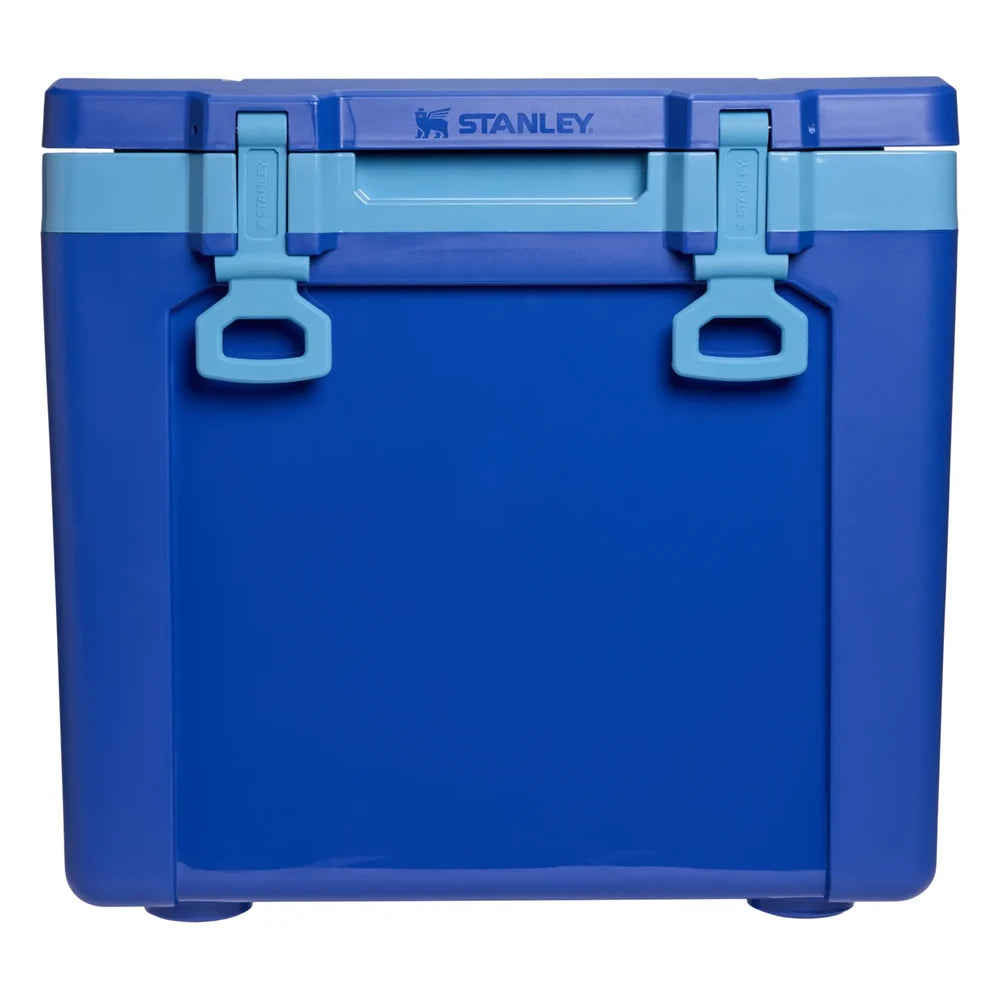 Stanley The Cold For Days Wheeled Outdoor Cooler 50QT in Azure Blue front hero on white background showing cobalt blue body with two sky blue D-ring latch handles and hinged lid, Stanley logo on top of lid, and sky blue lid trim accent