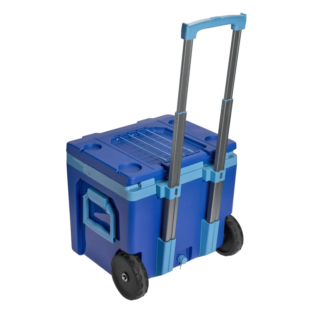 Stanley The Cold For Days Wheeled Outdoor Cooler 50QT in Azure Blue three-quarter view from behind on white background showing closed lid with molded cup holders on top, sky blue telescoping handle fully extended, cobalt blue body with sky blue side carry handle, and both large black all-terrain wheels visible
