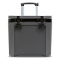 Stanley The Cold For Days Wheeled Outdoor Cooler 50QT in Charcoal Black front hero on white background showing gray charcoal body with two black D-ring latch handles, telescoping handle fully extended with black grip at the top, and Stanley logo on the lid with black trim accent