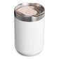 Stanley Every Day Camp Mug 12oz in Hammertone Frost lid close-up on white background showing the flip-up transparent sip cover open and hinged back, revealing the blush rose gold slide tab with Stanley winged bear icon, surrounded by the brushed stainless steel lid ring and collar with white hammertone body visible below