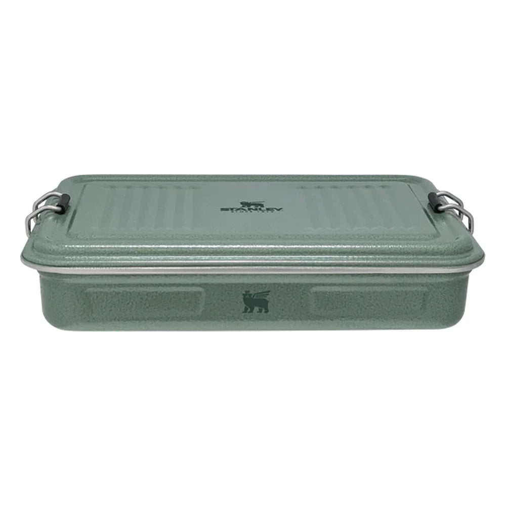 Stanley Legendary Classic Lunch Box front hero on white background showing closed box in hammertone green enamel finish with ribbed lid texture, Stanley logo on top, bear icon embossed on front, and stainless steel bail latches on both sides
