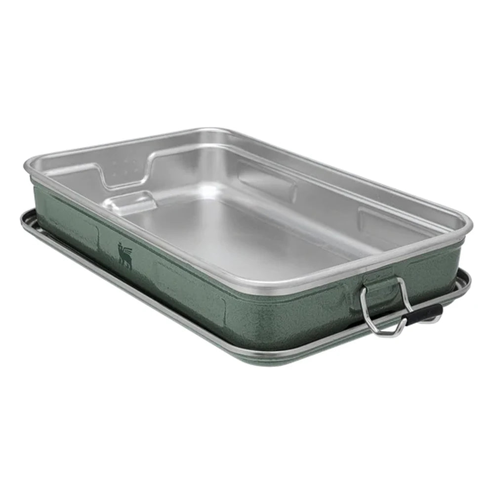 Stanley Legendary Classic Lunch Box open on white background showing the removable stainless steel interior tray with divider notch, set inside the hammertone green enamel base with bail latch visible on side