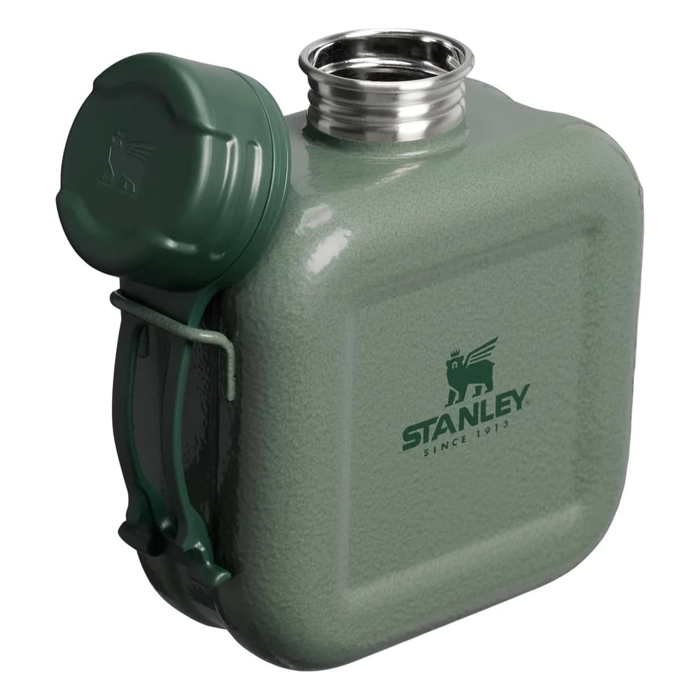 Stanley Next X Nature Canteen in Hammertone Green three-quarter view on white background with cap swung open on its tether cord revealing the stainless steel wide-mouth opening with threads, wire bail frame visible on the left side, and Stanley Since 1913 winged bear logo on the hammertone green enamel body