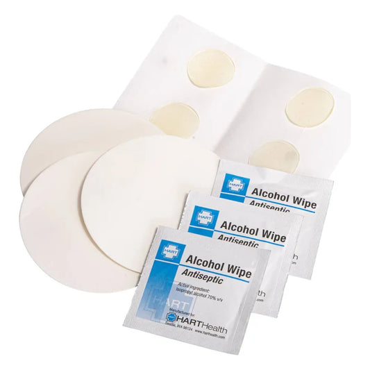Therm-a-Rest Instant Field Repair Kit contents on white background: three large circular clear adhesive patches, sheet of five small round patches, and three antiseptic alcohol wipe packets